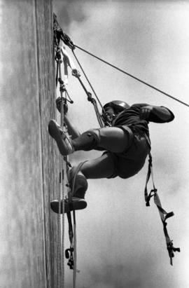 Joel Lindmeer climbs an Atwood Memorial Center (1966) wall, St. Cloud State University