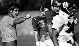 Football coach Mike Simpson directs his players, St. Cloud State University