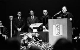 Brendan McDonald and others listen to a speaker, Brendan McDonald inauguration, St. Cloud State University