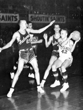 St. Cloud State University basketball player John Blomlie looks to pass the ball during a basketball game