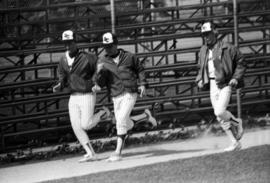 Dave Prax, Joe Sybrant, and Dave Neubauer run together during a St. Cloud State University baseball game