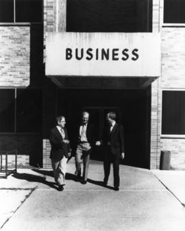 Men walk outside of School of Business (1968) building, St. Cloud State