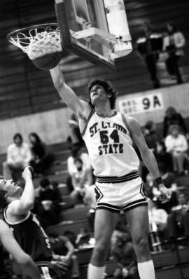 St. Cloud State University basketball player Dan Hagen dunks a basketball during a game against Winona State University