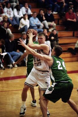 Jason Kron holds the basketball during a basketball game against the University of North Dakota, St. Cloud State University