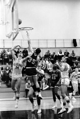 St. Cloud State basketball player Izzy Schmiesing jumps for a rebound during a basketball game against Western Illinois