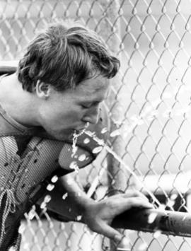 Football player Brad Noel takes a drink of water, St. Cloud State University