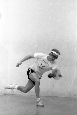 A man plays racquetball, St. Cloud State University