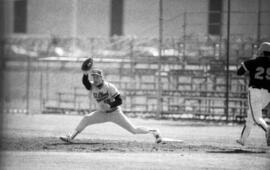 Baseball player Pete Pratt catches a baseball at first base during a game, St. Cloud State University