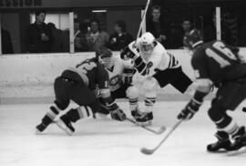 Hockey players chase the puck, St. Cloud State University