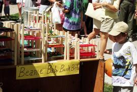 A boy looks at merchandise, Lemonade Concert and Art Fair, St. Cloud State University