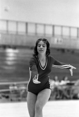 Woman gymnast competes in a meet, St. Cloud State University