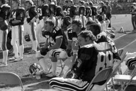 St. Cloud State University football player Steve Schuldt (#79) and his teammates gather together during a game against Augustana College