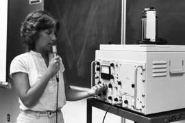 A woman speaks into a microphone, Speech Pathology, St. Cloud State University