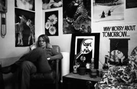 A woman relaxes in her dormitory room, St. Cloud State University