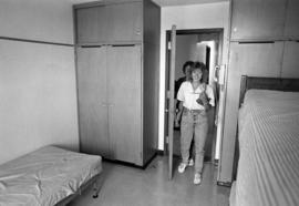 A new student tours a residence hall during orientation, St. Cloud State University