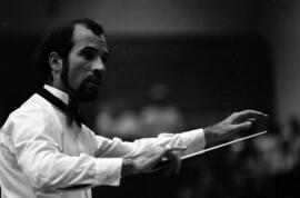 A man conducts the Minnesota Orchestra, Lemonade Concert and Art Fair, St. Cloud State University