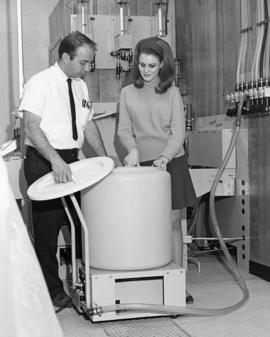 Woman and a man work with scientific equipment, St. Cloud State University