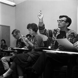 Student asks a question in class, St. Cloud State University