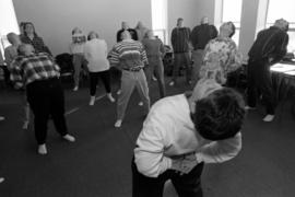 Zoa Rockenstein leads her class in yoga exercises, St. Cloud State University