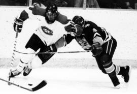 Matt Cullen handles a hockey puck in a game against the University of Minnesota-Duluth, St. Cloud State University