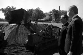 Minnesota state college chancellor Theodore Mitau and St. Cloud State president Charles Graham watch the beginning of the construction of the Wick Science Building (1973)