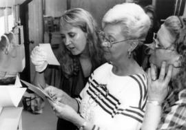 Lesley Lewis, Pat Lewis and Pat Schenk look at Sinclair Lewis material at University Archives, St. Cloud State University