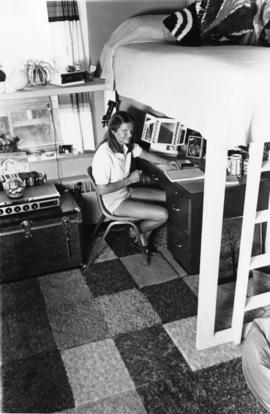 Student studies at her desk, St. Cloud State University