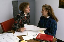 Librarian Susan Hubbs helps a student, St. Cloud State University