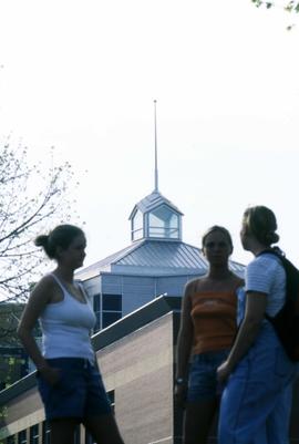 Women stand in front of Miller Center (2000), St. Cloud State University