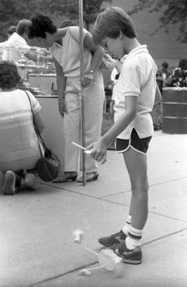 A boy plays with a toy, Lemonade Concert and Art Fair, St. Cloud State University