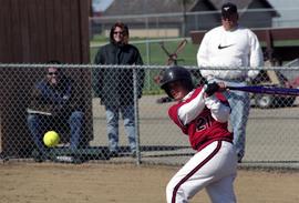 Softball player Jamie Trachsel hits a softball during a game, St. Cloud State University