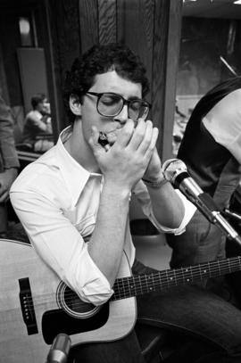 Jeff Wood of the band Almost Gentlemen plays the harmonica, St. Cloud State University