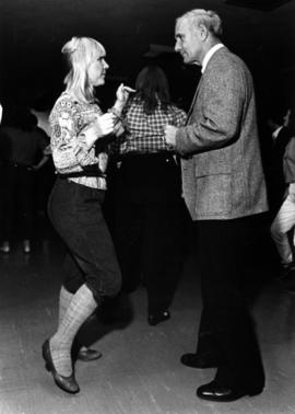 President Brendan McDonald dances with Erika Vora, St. Cloud State