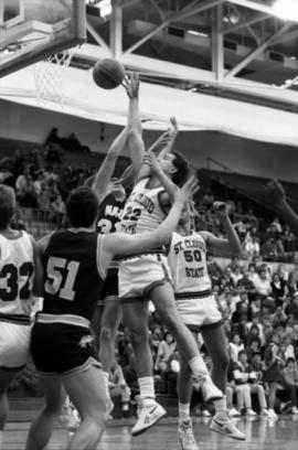 Basketball player Bill Petersen takes a shot during a game against North Dakota State University, St. Cloud State University