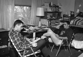 Two men relax in their dormitory room, St. Cloud State University