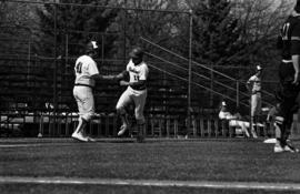 Denny Lorsung shakes Jim Eisenreich's hand during a St. Cloud State University baseball game against Northern State University