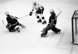 Hockey player Mike Turgeon takes a shot against the alumni team, St. Cloud State University