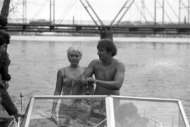 Vickie McLeary and Peter Noll prepare to swim across the Mississippi River, St. Cloud State University