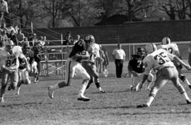 St. Cloud State University football player Mike Mullen runs the ball during a football against the University of Minnesota-Duluth