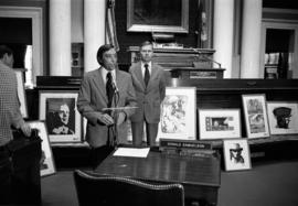 Jim Pehler and Charles Graham with art prints donated to House Chamber at the State Capitol, St. Cloud State University