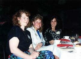 Jessica Ostman and two women sit together at the Excellence in Leadership banquet, St. Cloud State University