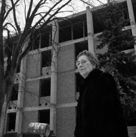 Marie Case standing in front of Case Hall (1964), St. Cloud State University