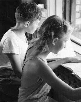 Children read books at Riverview (1913), St. Cloud State University