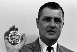 James Roy with the presidential medal, St. Cloud State University