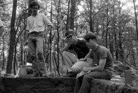 Three men at an archaeology dig at the Sherburne National Wildlife Refuge, St. Cloud State University