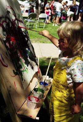 A girl paints, Lemonade Concert and Art Fair, St. Cloud State University