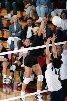 Cami Selbitschka spikes a volleyball during a volleyball match against Augustana College, St. Cloud State University