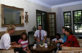 Group sits in Lewis House (1973), St. Cloud State University