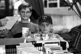 Two boys look at merchandise, Lemonade Concert and Art Fair, St. Cloud State University