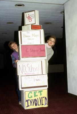 University Program Board (UPB) students stand with a display